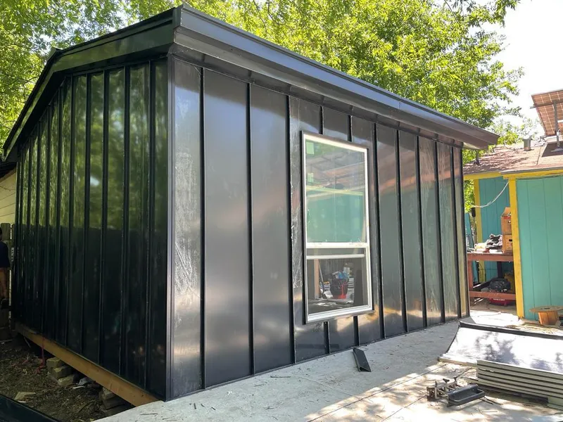 Black standing seam metal wall panels for Roof Inspection in Winterset